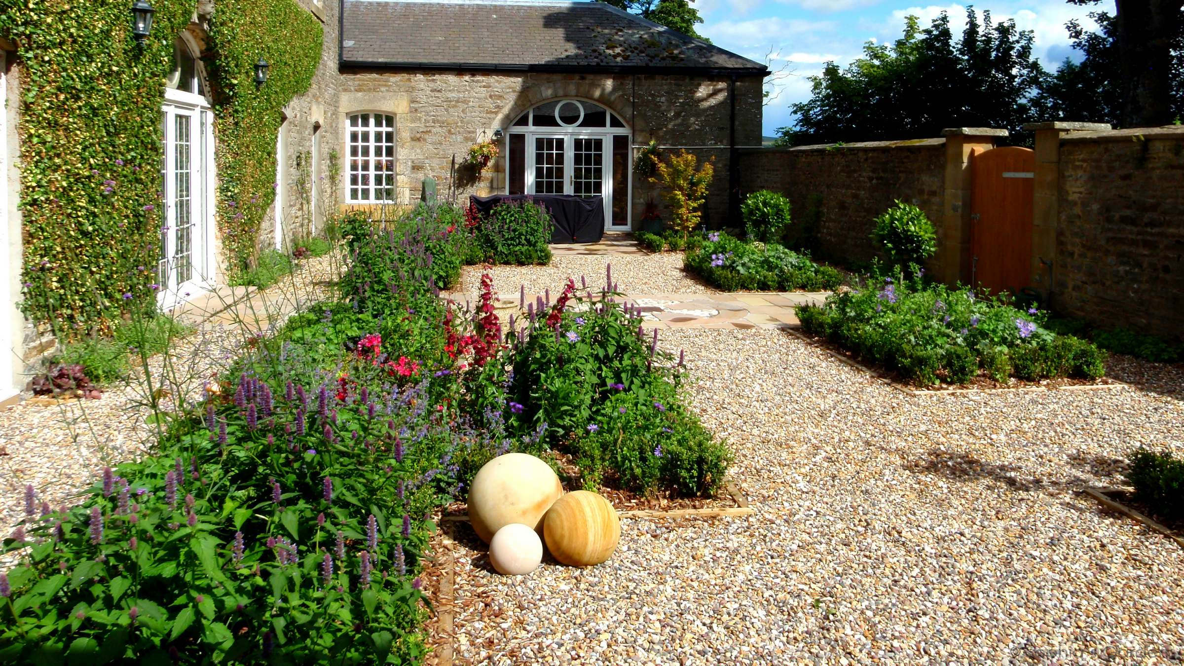 Old stone courtyard parterre garden in Weardale, by Sophia's Gardens